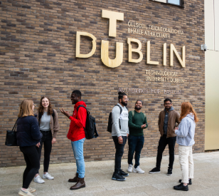 group photo of students standing outside the east Quad building