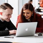 Students studying at a laptop