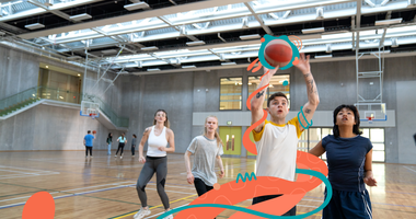 students playing basketball in hall