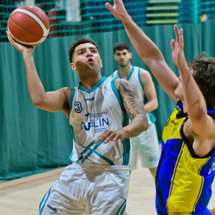 student playing basketball