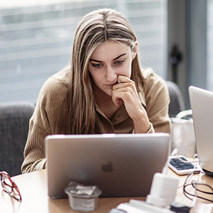 student looking at laptop screen in TUDublin