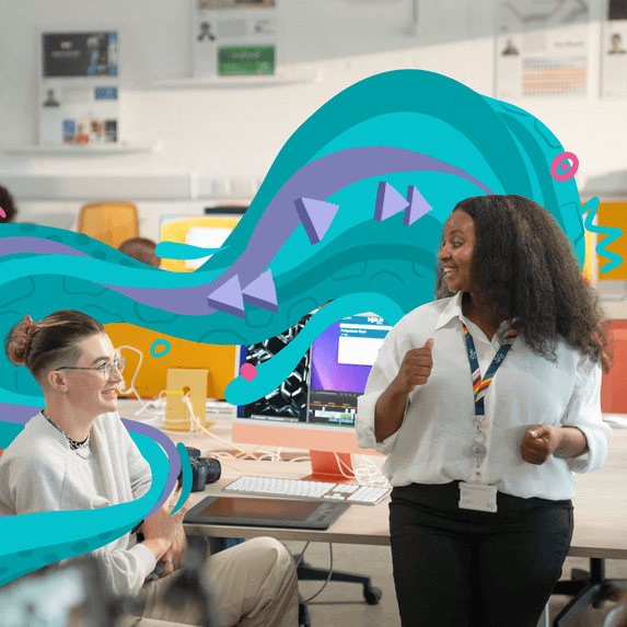 students chatting at computer desk