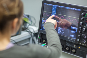 girl working in lab pointing at computer screen