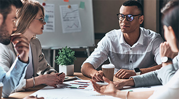 Discussing ideas around a desk