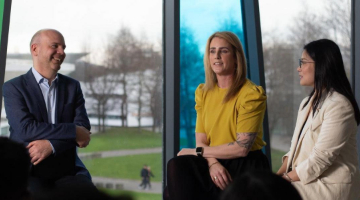 3 members at business conference having a discussion