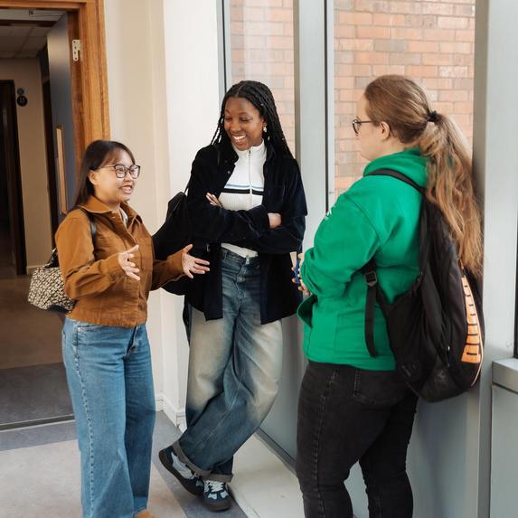Postgrad students in corridor